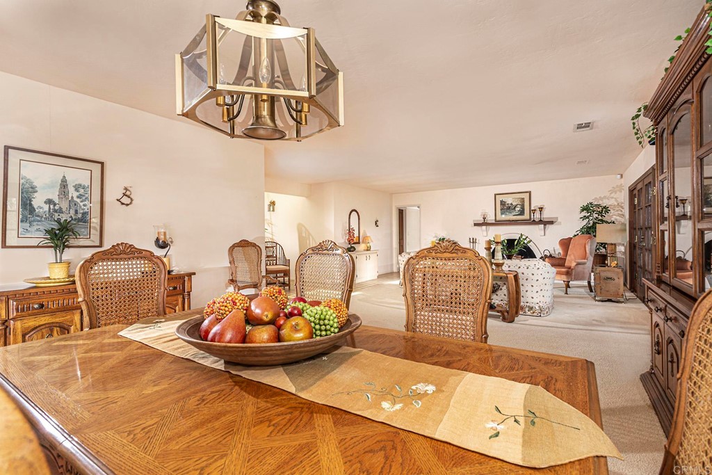 16854 Los Morros Rancho Santa Fe, CA 92067 - Photo 9 of 40 a living room with furniture and a chandelier