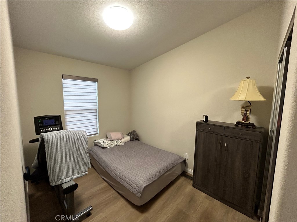 17 Gomes Way Brea, CA 92821 - Photo 20 of 47 a bedroom with a bed and wooden floor