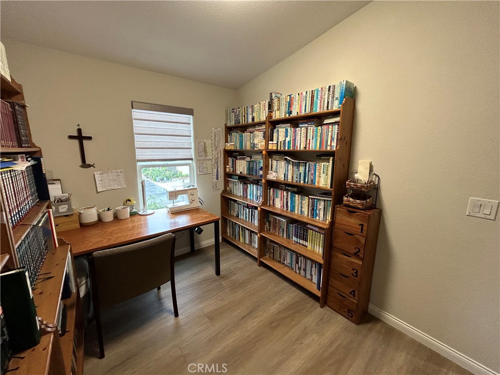 17 Gomes Way Brea, CA 92821 - Photo 23 of 47 a view of a workspace with furniture and a bookshelf