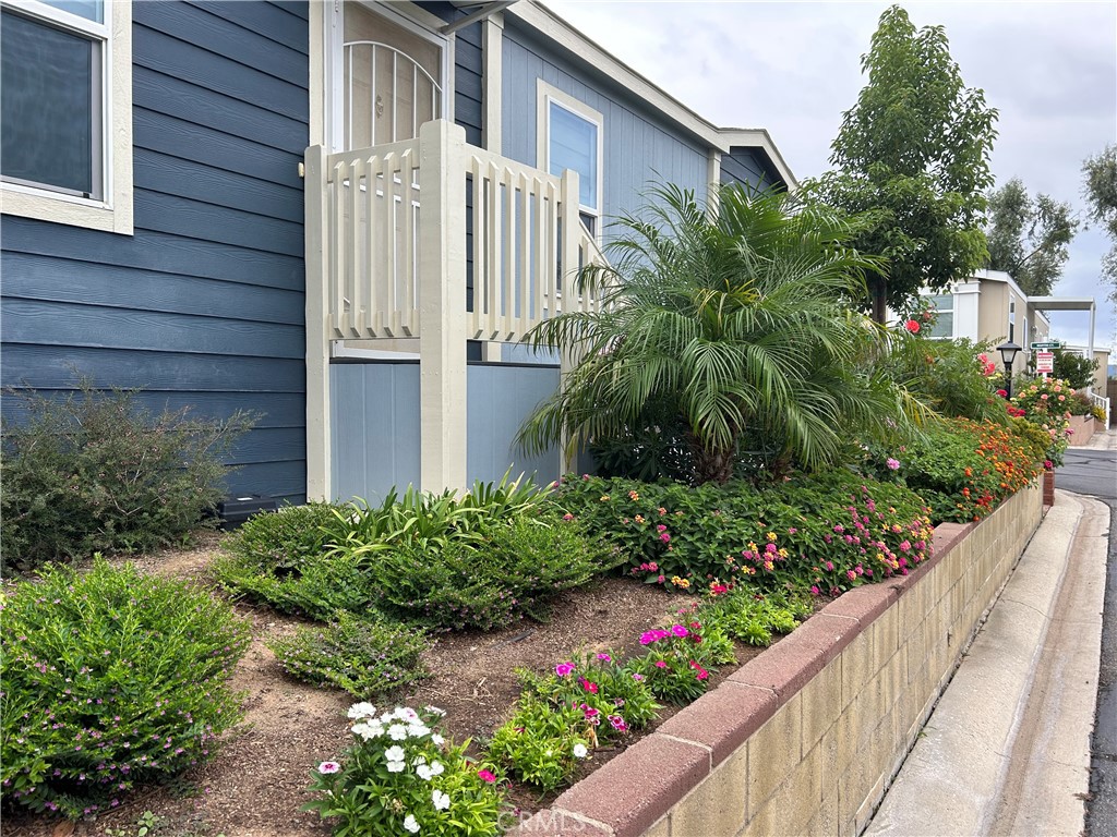 17 Gomes Way Brea, CA 92821 - Photo 7 of 47 a view of a house with a lot of flower garden