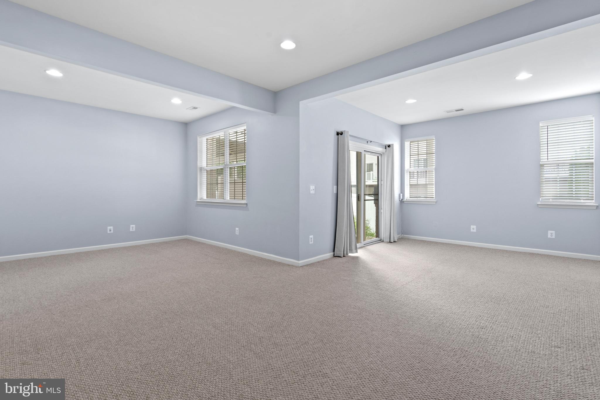22667 Flowing Spring Square Brambleton, VA 20148 - Photo 30 of 39 an empty room with windows and closet