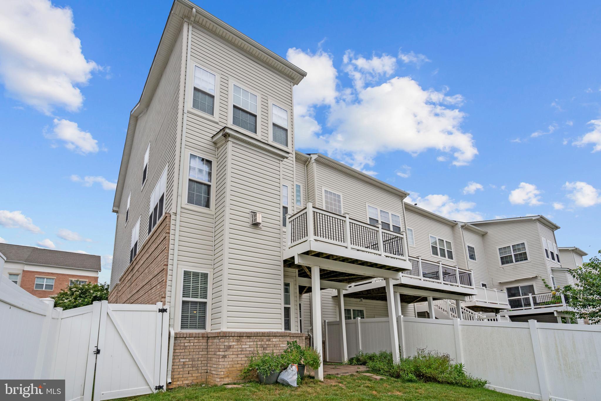 22667 Flowing Spring Square Brambleton, VA 20148 - Photo 37 of 39 a view of a white building among the street