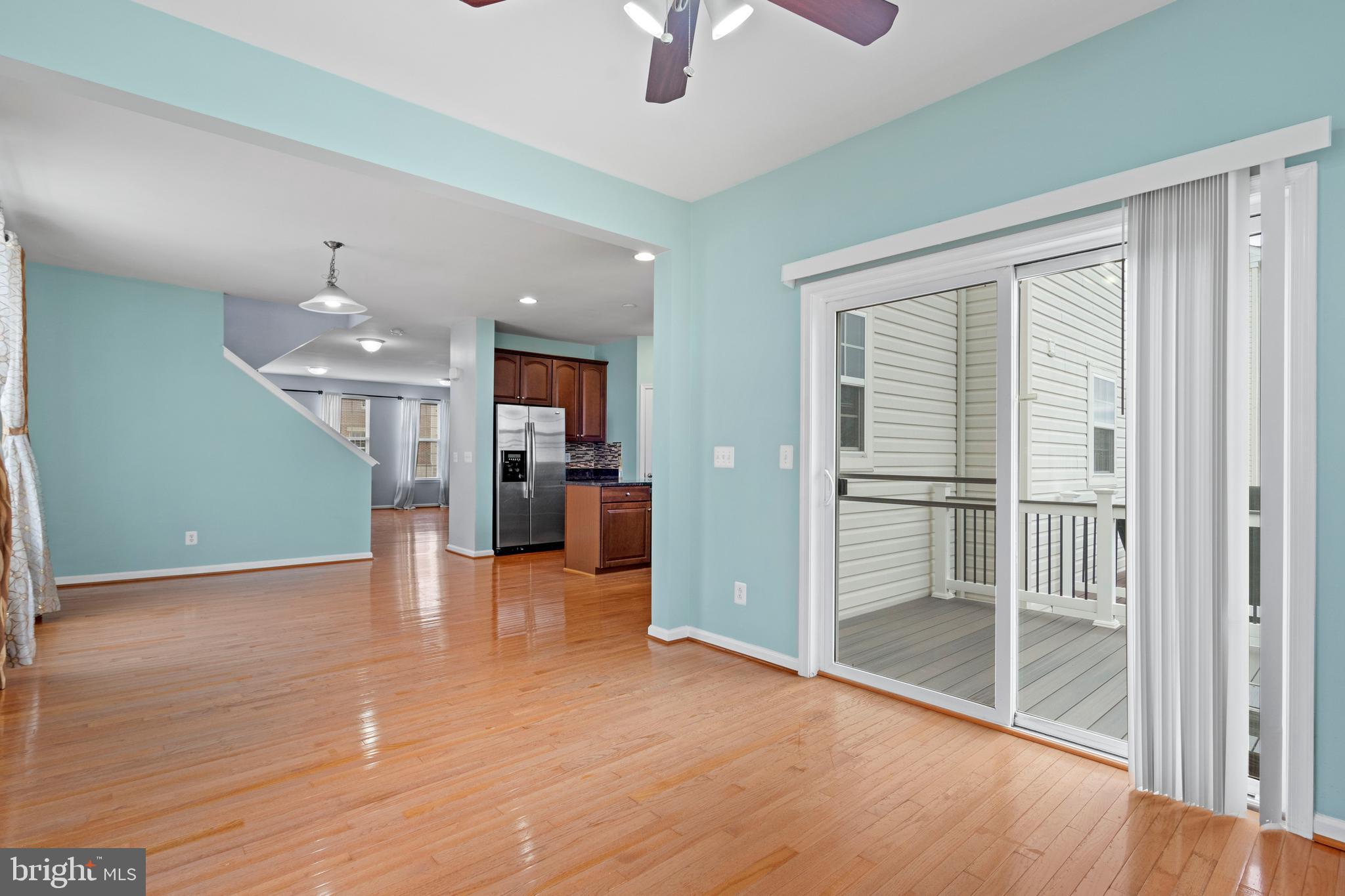 22667 Flowing Spring Square Brambleton, VA 20148 - Photo 10 of 39 a view of a livingroom with furniture wooden floor and window