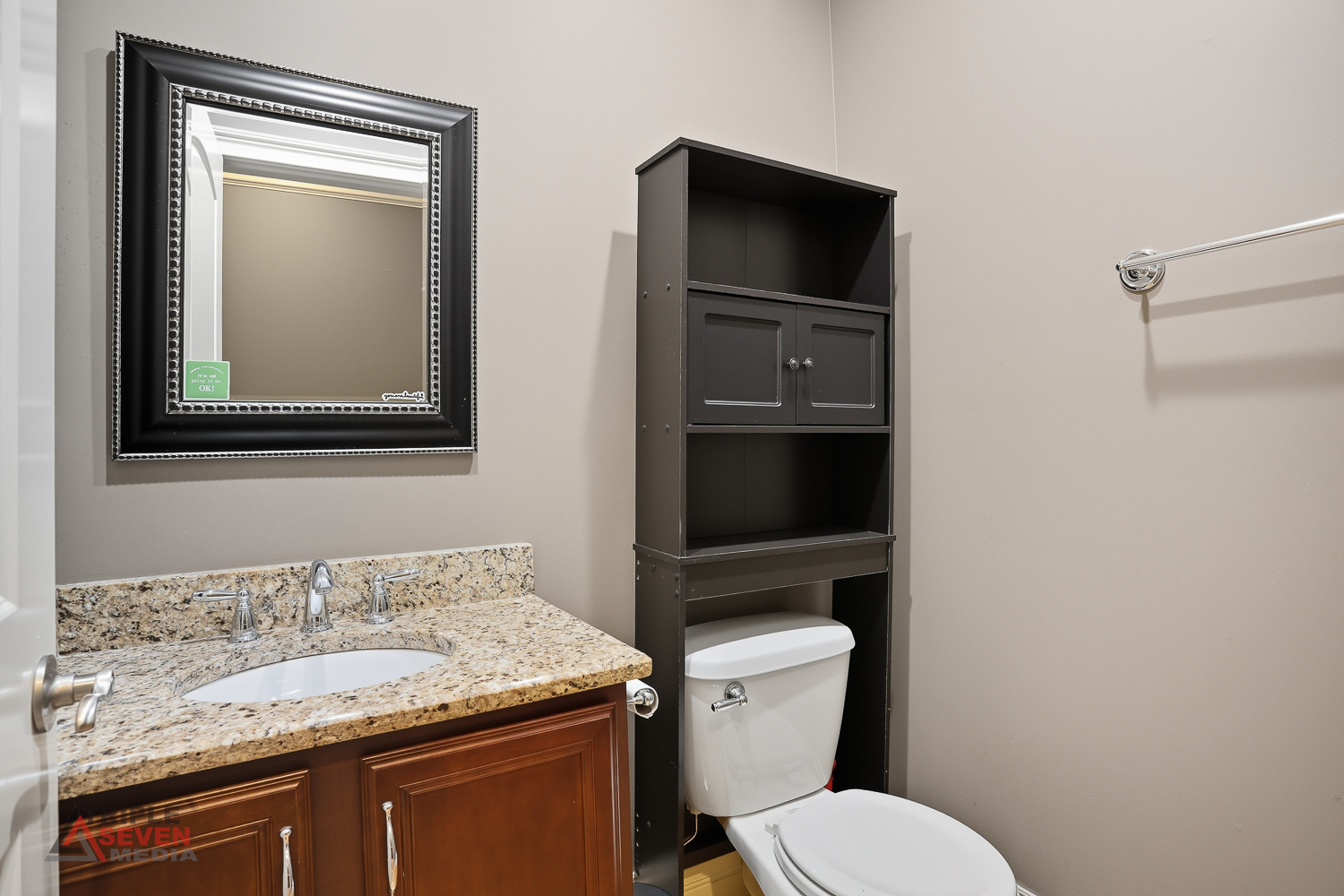 5039 South Michigan Avenue, Unit 1S Chicago, IL 60615 - Photo 11 of 25 a bathroom with a granite countertop toilet and a sink