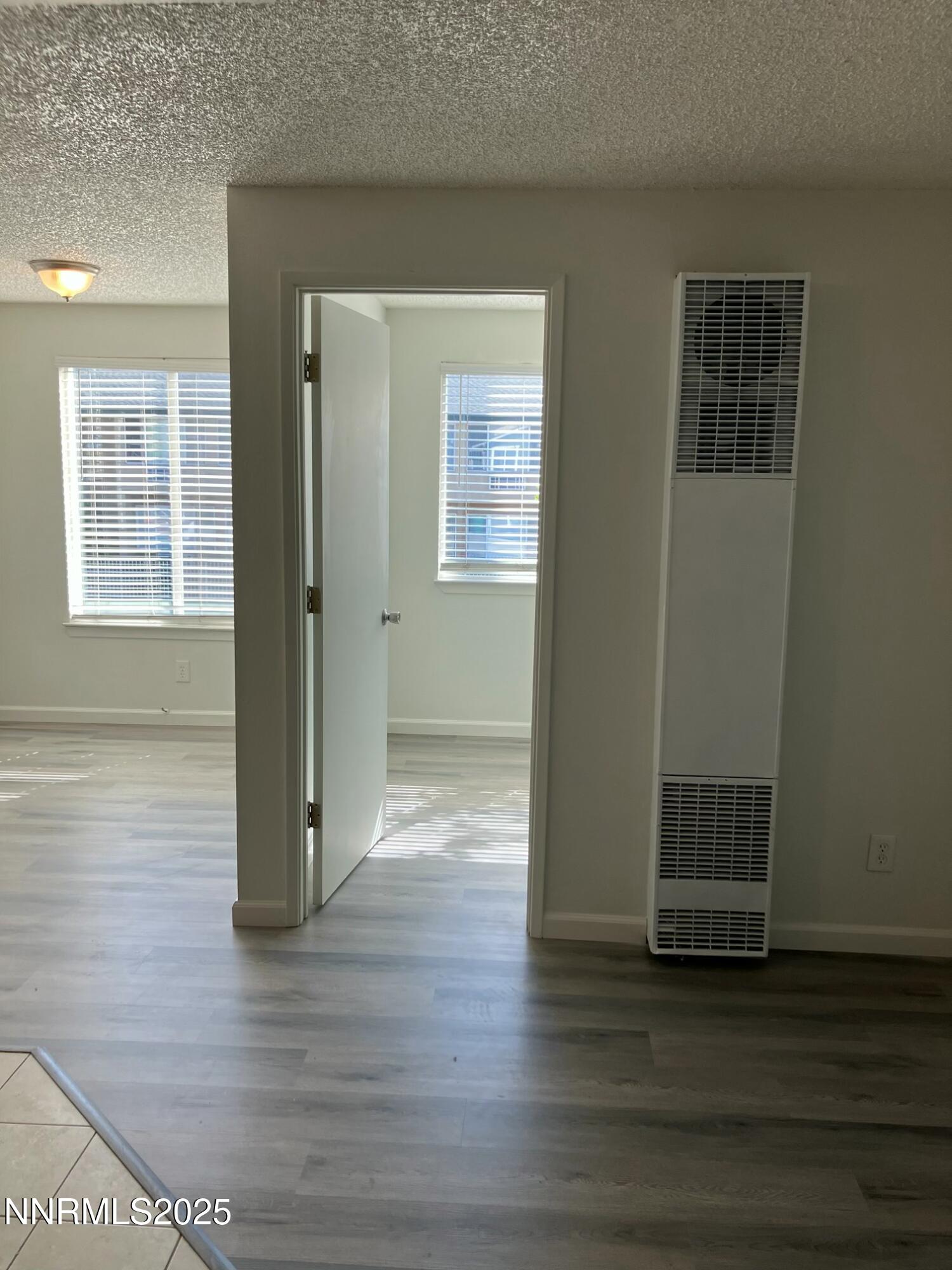 29 Park Street Reno, NV 89502 - Photo 13 of 17 an empty room with wooden floor and windows