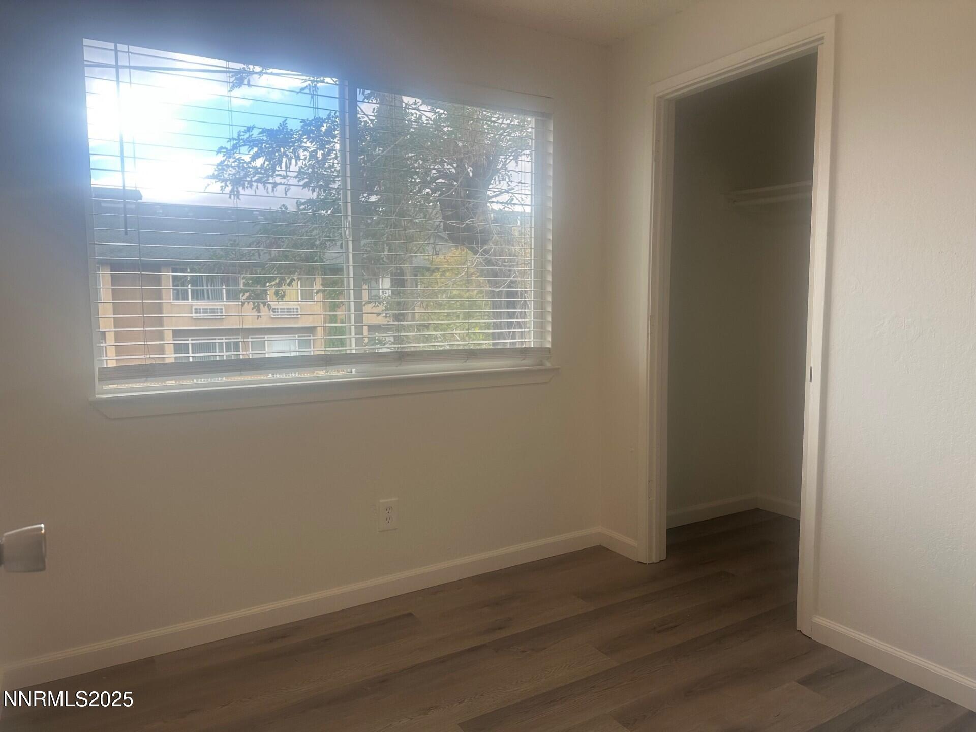 29 Park Street Reno, NV 89502 - Photo 16 of 17 an empty room with wooden floor and windows
