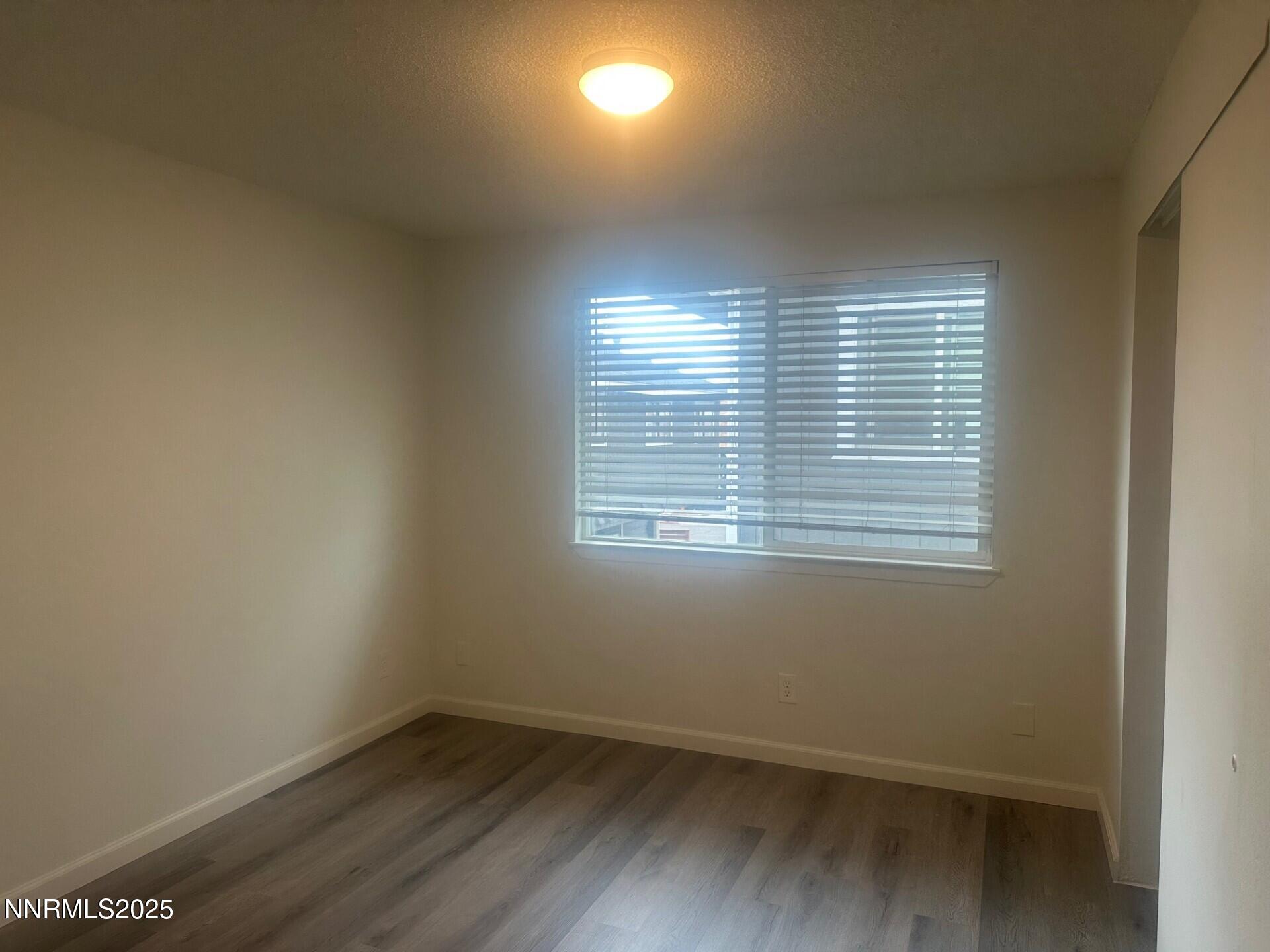 29 Park Street Reno, NV 89502 - Photo 17 of 17 an empty room with wooden floor and windows