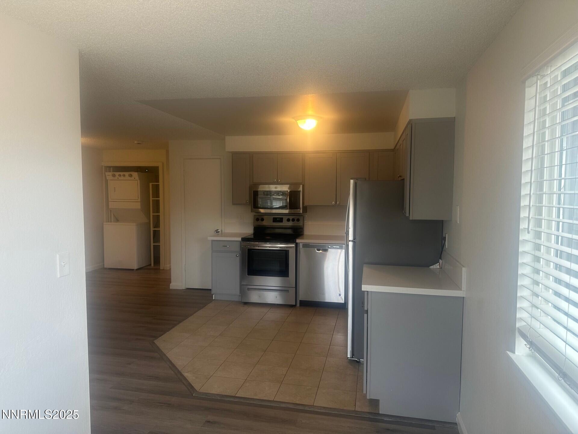 29 Park Street Reno, NV 89502 - Photo 8 of 17 a kitchen with stainless steel appliances a refrigerator and a stove top oven