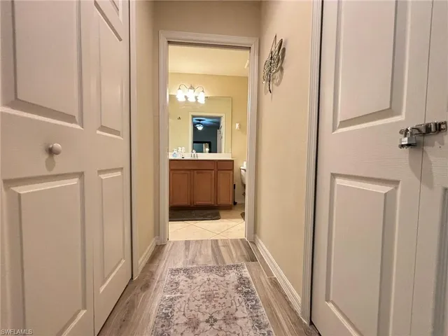 a bathroom with a double vanity sink mirror and toilet