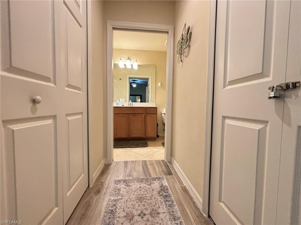 10341 Heritage Bay Boulevard, Unit 1922 Naples, FL 34120 - Photo 12 of 36 a bathroom with a sink and mirror