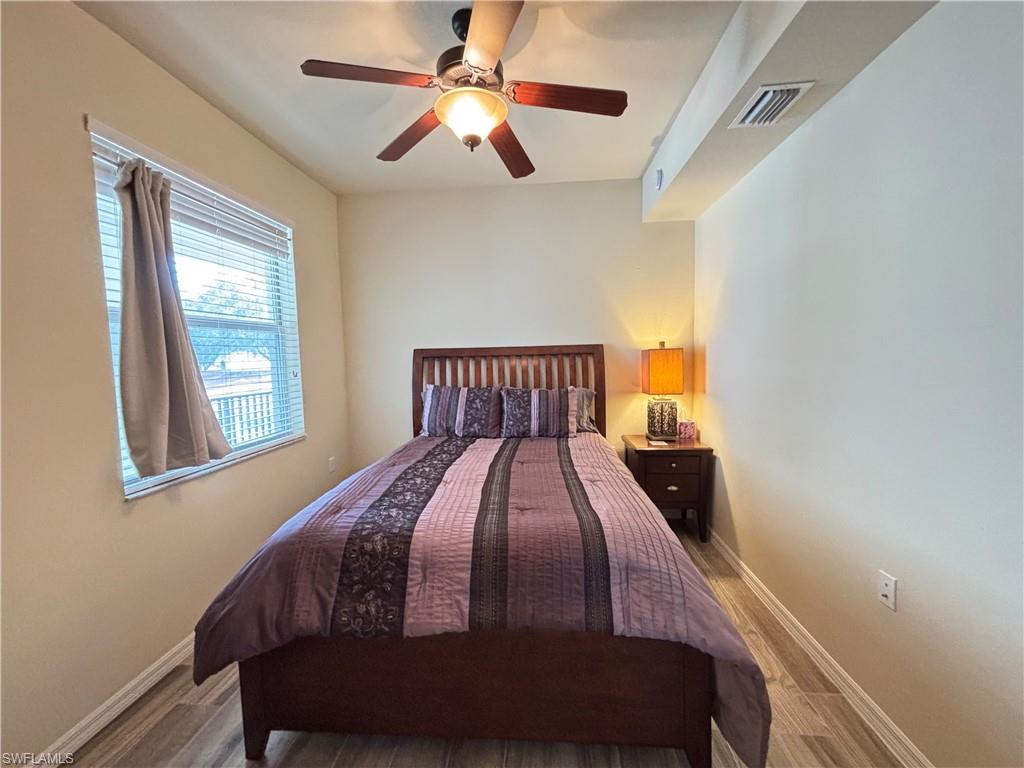 10341 Heritage Bay Boulevard, Unit 1922 Naples, FL 34120 - Photo 15 of 36 a bedroom with a bed and window