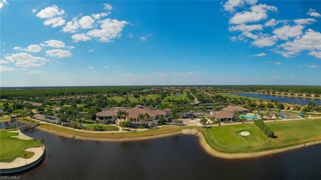 an aerial view of multiple houses with yard