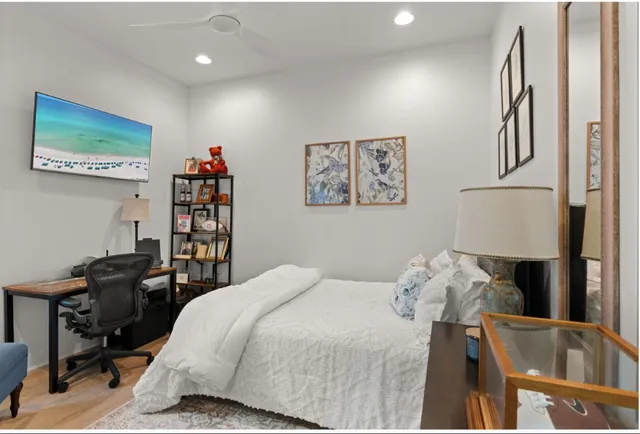 a bedroom with a bed and a book shelf