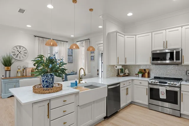 a kitchen with a sink stove and microwave