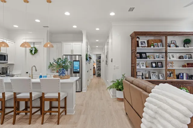 a living room with furniture and a book shelf