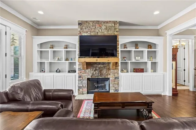 a living room with furniture window and a fireplace