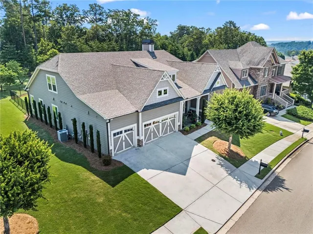 an aerial view of a house having swimming pool