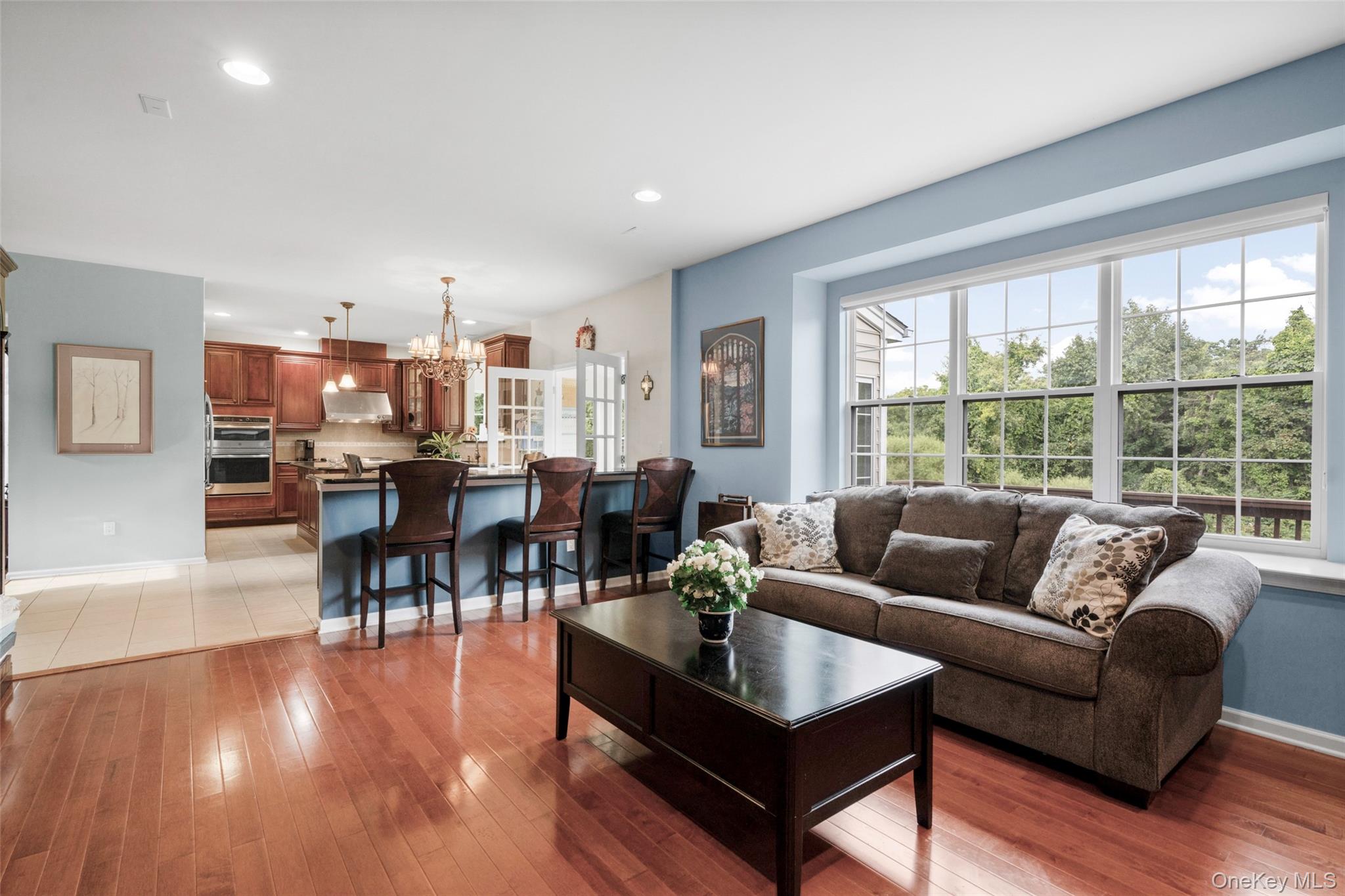 653 Creekside Lane Fishkill, NY 12524 - Photo 11 of 36 a living room with furniture and a large window