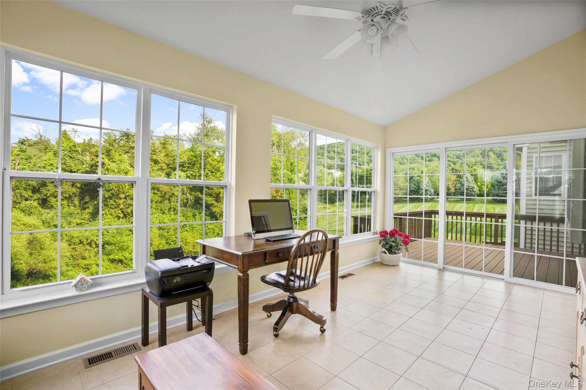 653 Creekside Lane Fishkill, NY 12524 - Photo 13 of 36 a living room filled with furniture and a large window