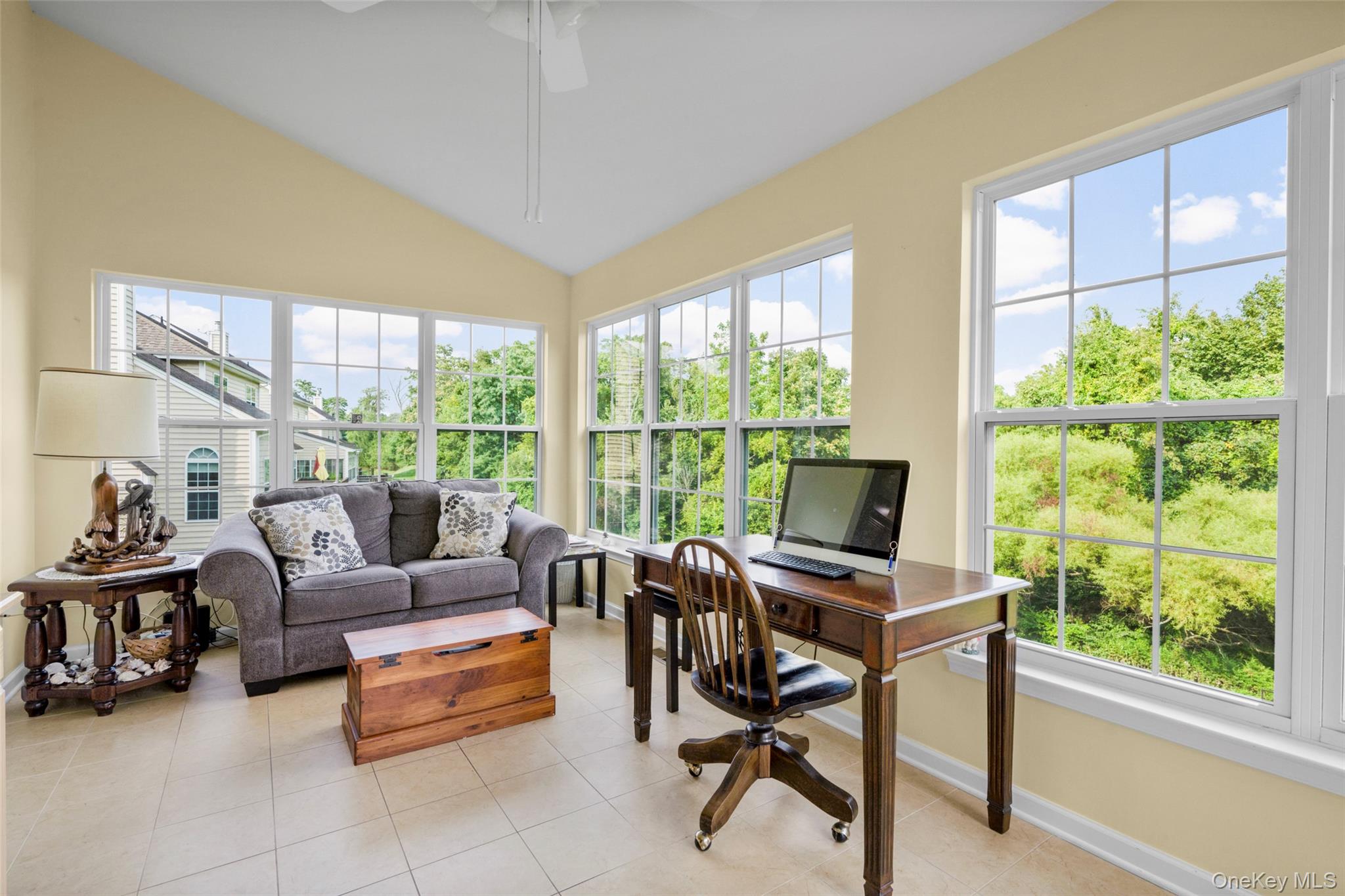653 Creekside Lane Fishkill, NY 12524 - Photo 14 of 36 a living room with furniture and a floor to ceiling window