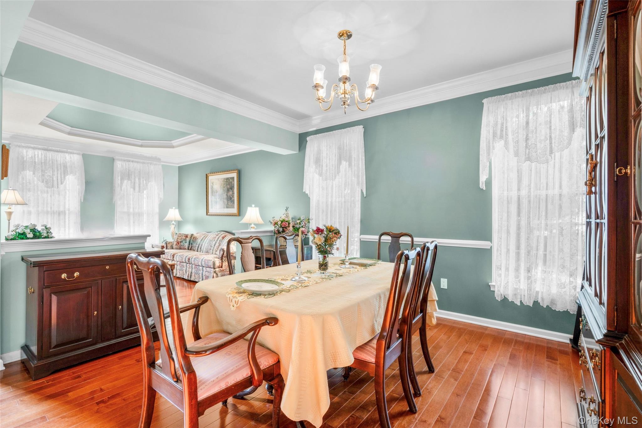 653 Creekside Lane Fishkill, NY 12524 - Photo 16 of 36 a view of a dining room with furniture window and wooden floor