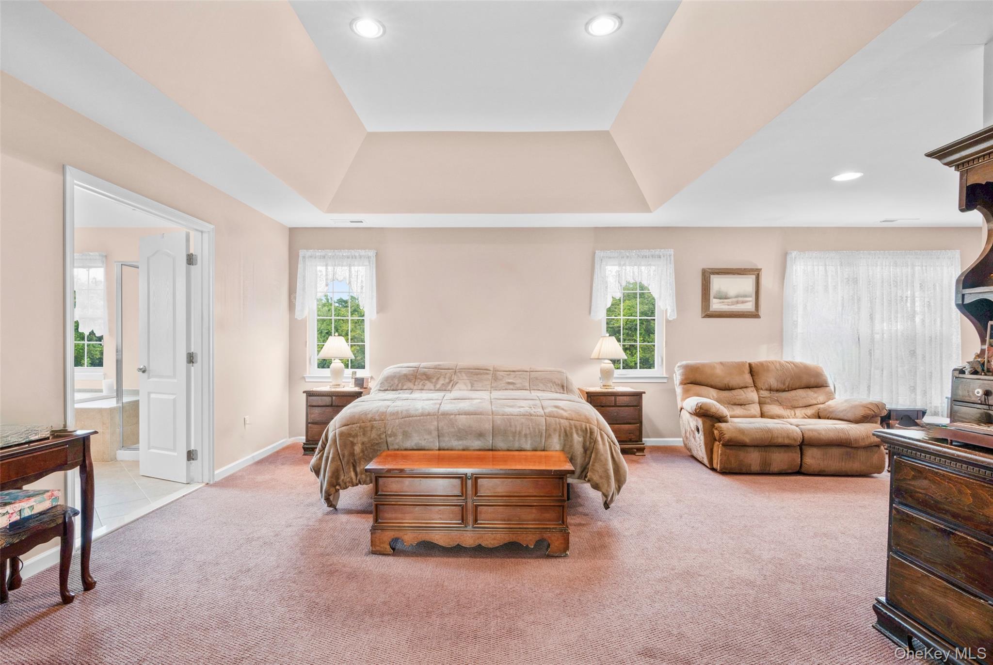 653 Creekside Lane Fishkill, NY 12524 - Photo 22 of 36 a spacious bedroom with a bed and furniture