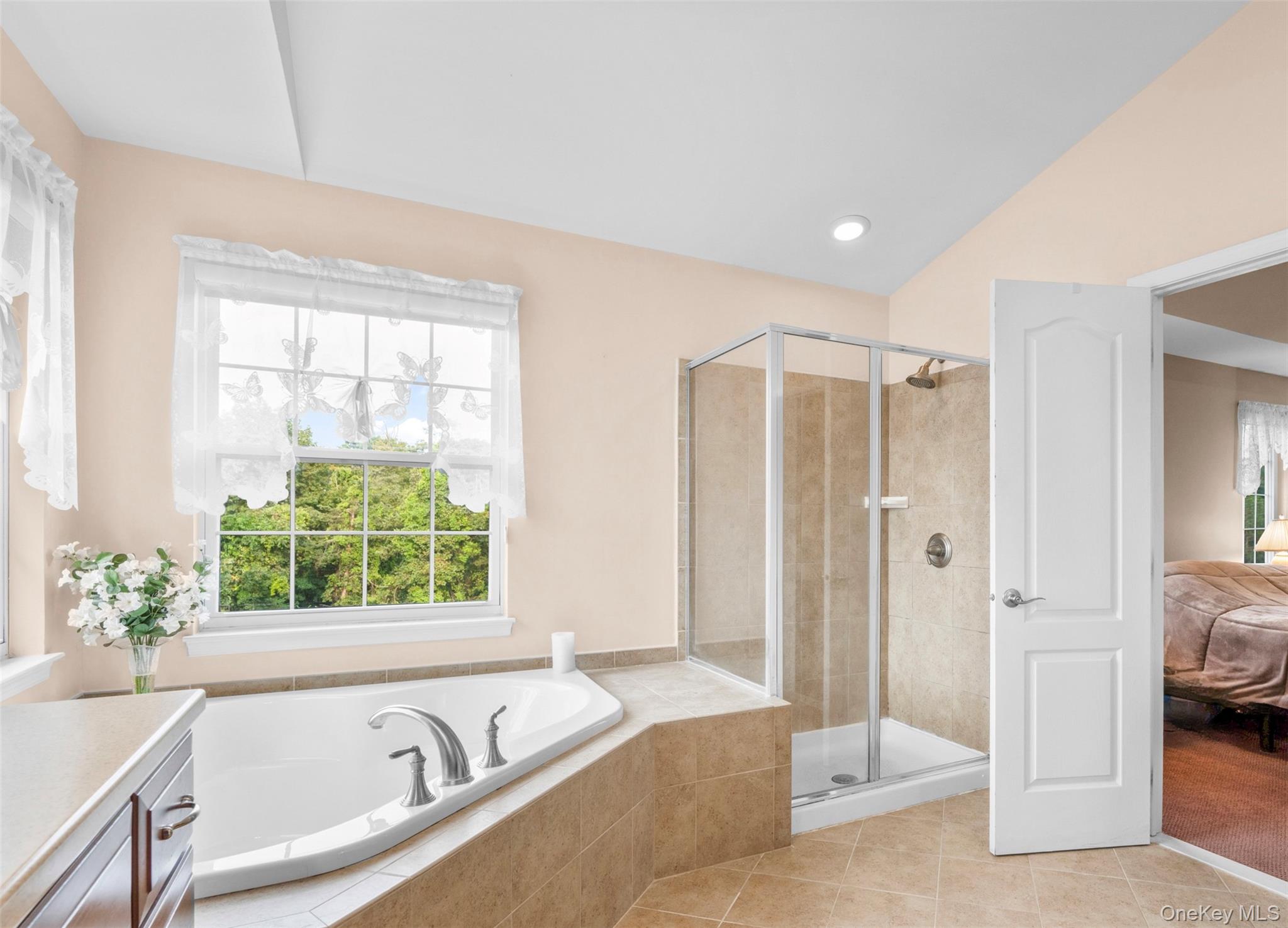 653 Creekside Lane Fishkill, NY 12524 - Photo 24 of 36 a spacious bathroom with a tub and shower