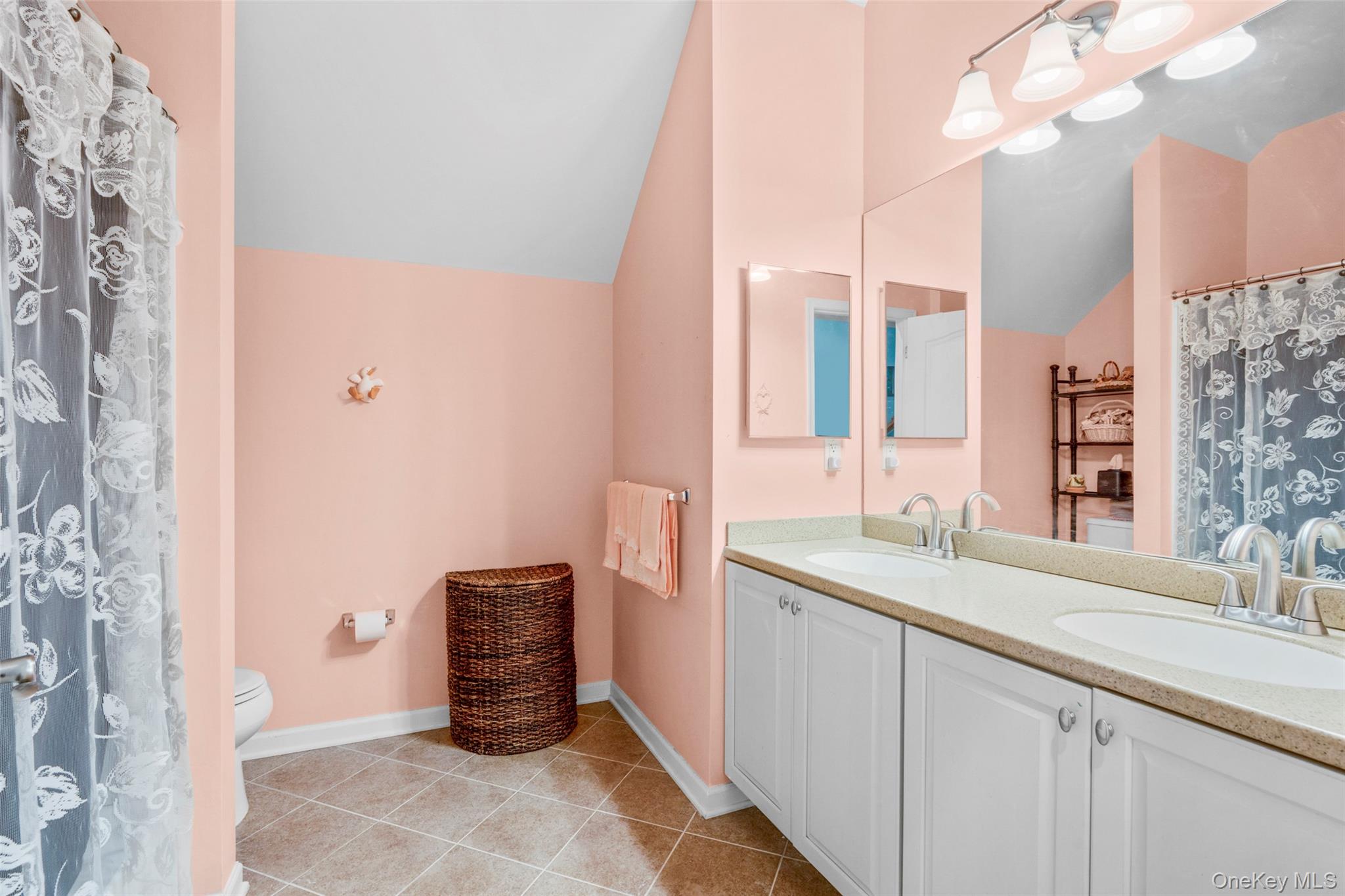 653 Creekside Lane Fishkill, NY 12524 - Photo 29 of 36 a bathroom with a sink and a mirror