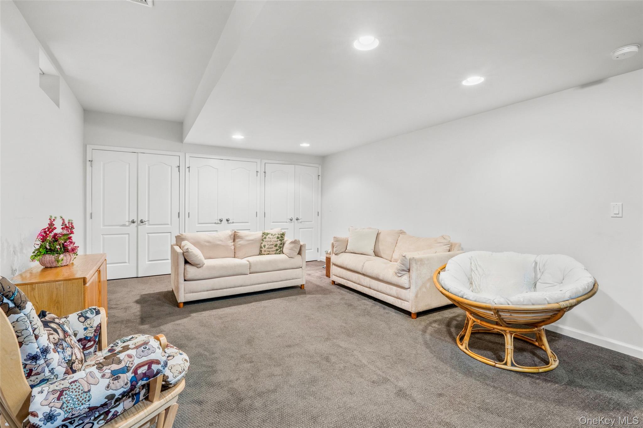 653 Creekside Lane Fishkill, NY 12524 - Photo 30 of 36 a living room with furniture a couch and a cabinet