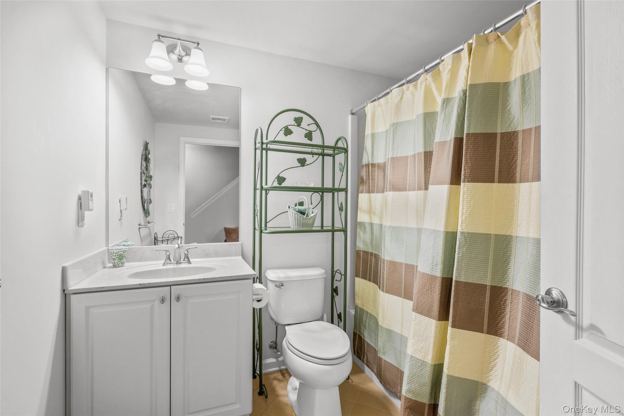 653 Creekside Lane Fishkill, NY 12524 - Photo 32 of 36 a bathroom with a sink toilet and shower