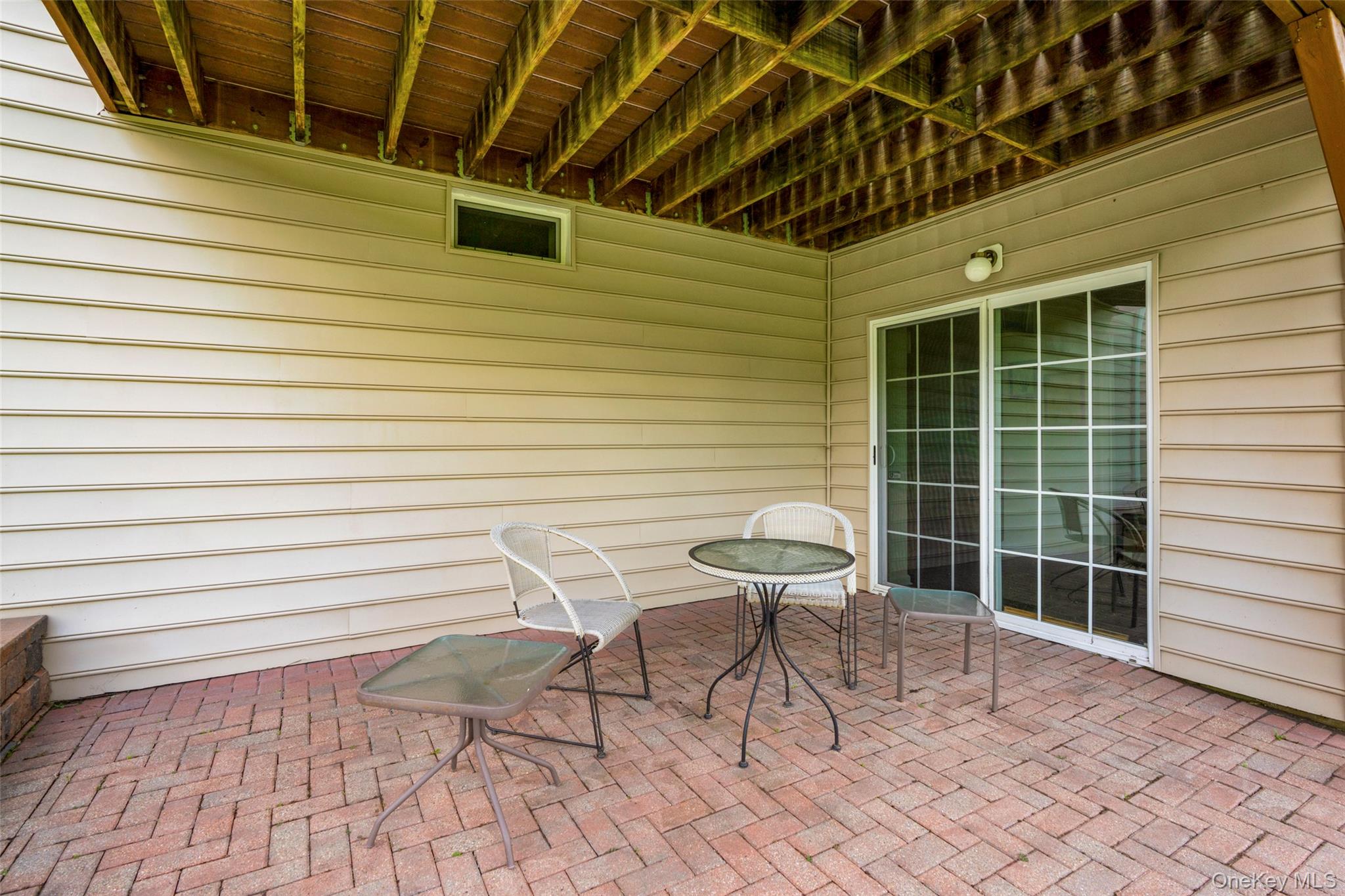 653 Creekside Lane Fishkill, NY 12524 - Photo 34 of 36 a roof deck with table and chairs and potted plants