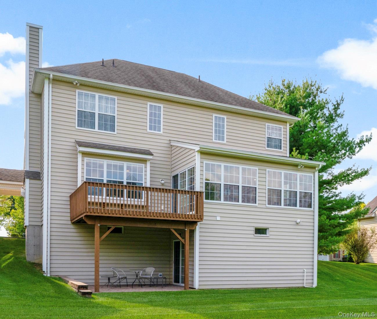 653 Creekside Lane Fishkill, NY 12524 - Photo 35 of 36 a front view of a house with a garden