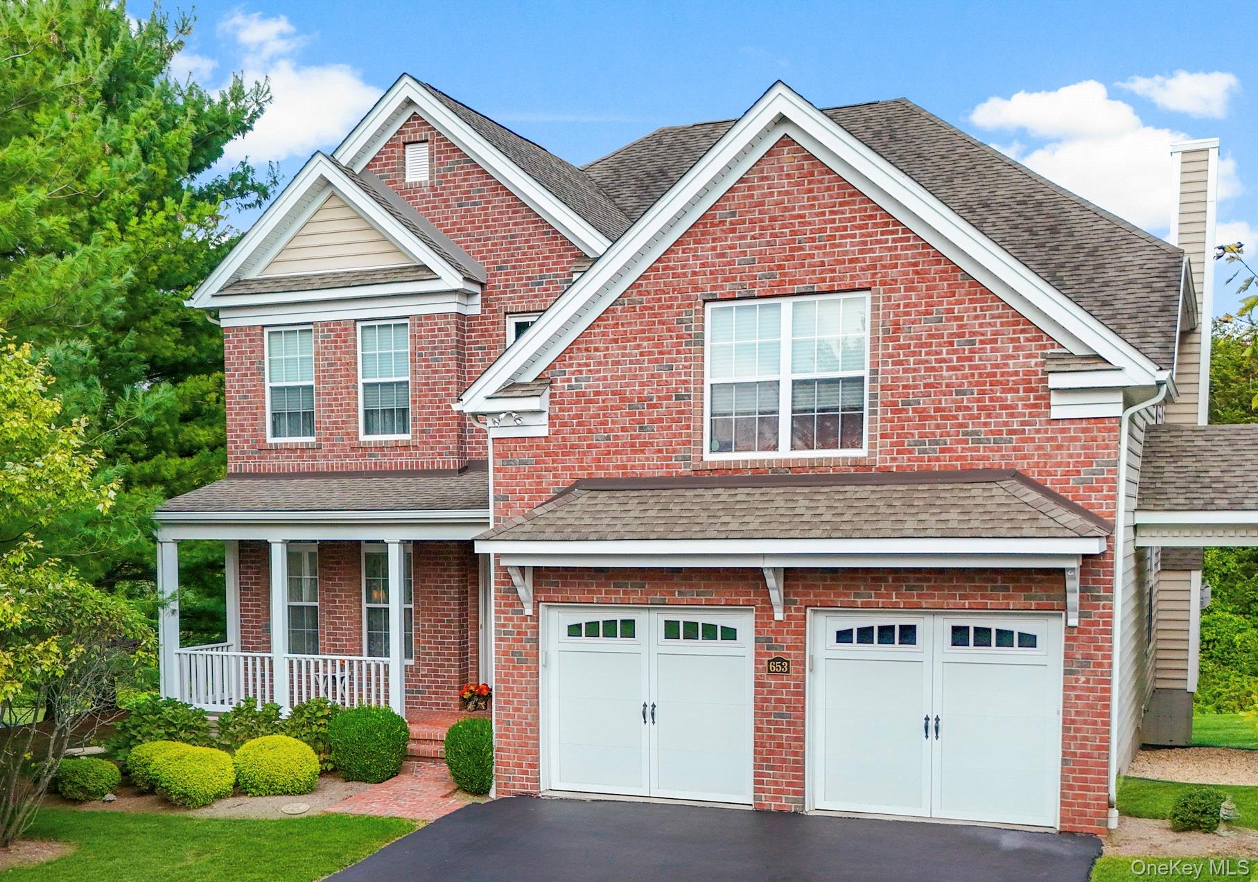 653 Creekside Lane Fishkill, NY 12524 - Photo 4 of 36 a front view of a house with garden