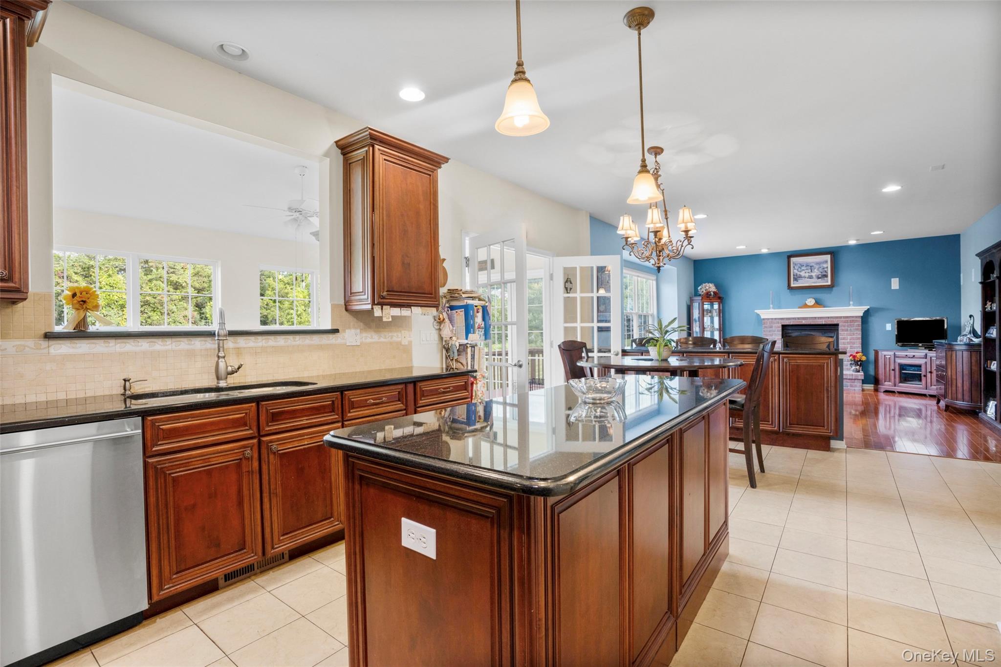 653 Creekside Lane Fishkill, NY 12524 - Photo 7 of 36 a kitchen with stainless steel appliances a sink stove and cabinets