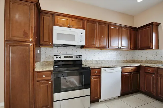a kitchen with a stove and a microwave