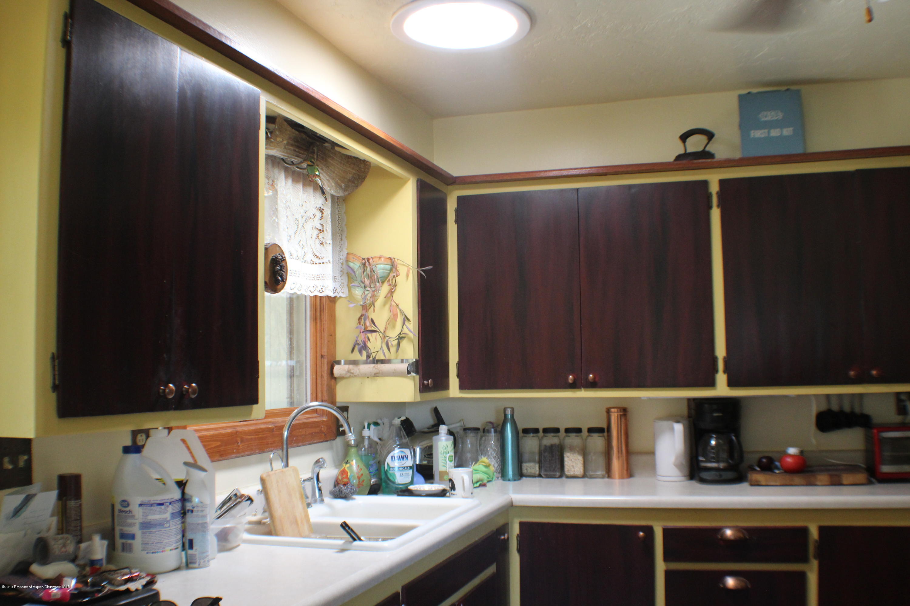 1521 County Road 252 Rifle, CO 81650 - Photo 11 of 24 a bathroom with a sink and a mirror
