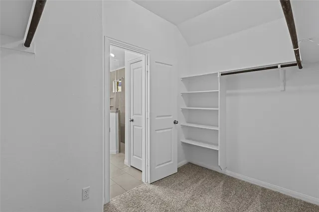 a view of an empty walk in closet