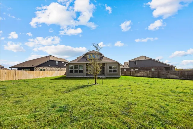 a house view with a garden space
