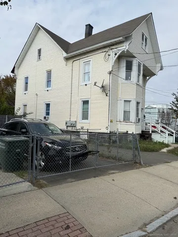a view of a white house with a outdoor space
