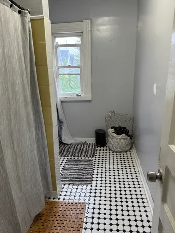 a bathroom with a sink and a shower