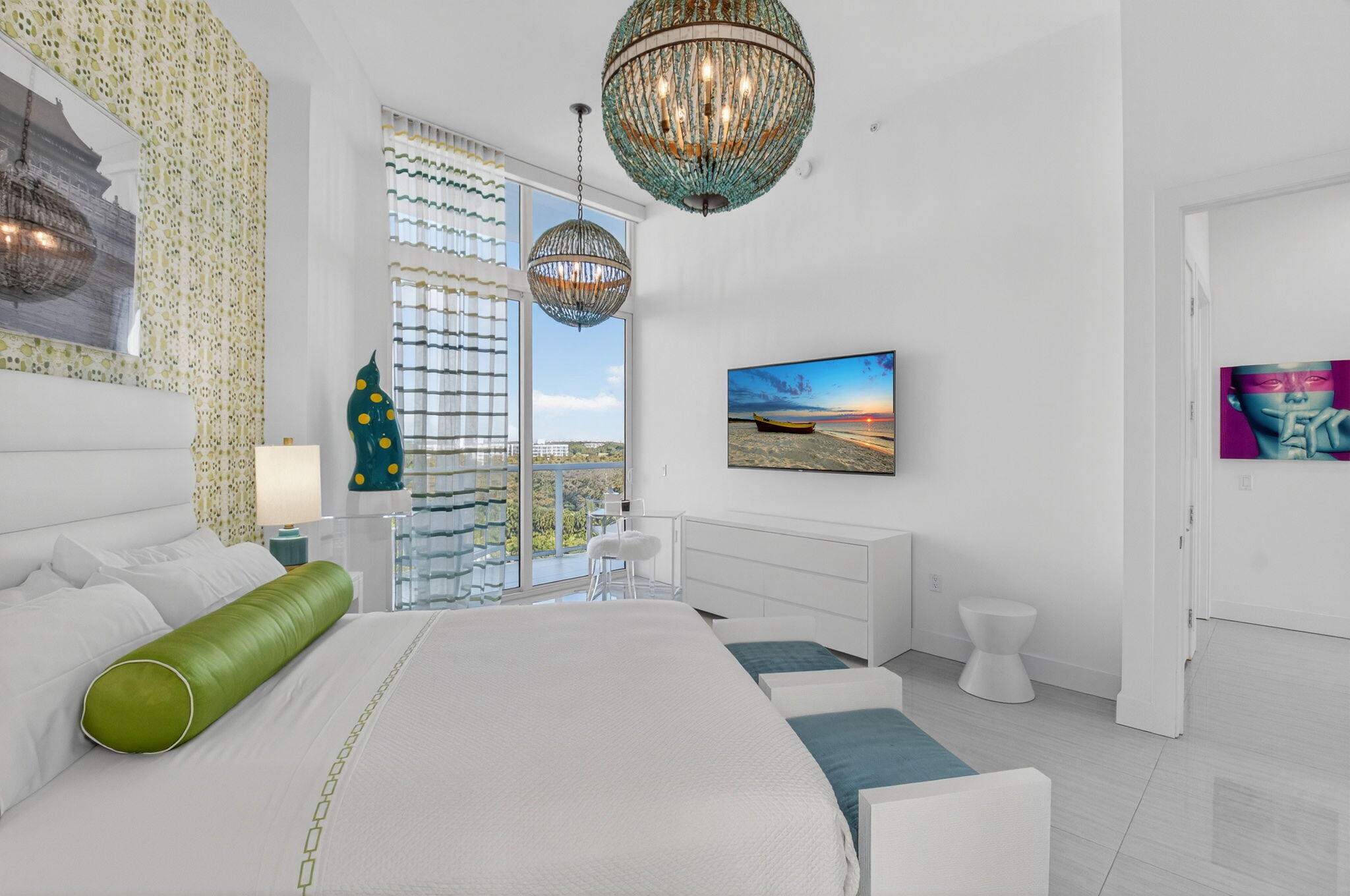 20155 Boca W Drive, Unit PHB904 Boca Raton, FL 33434 - Photo 21 of 50 a bedroom with a bed and a chandelier