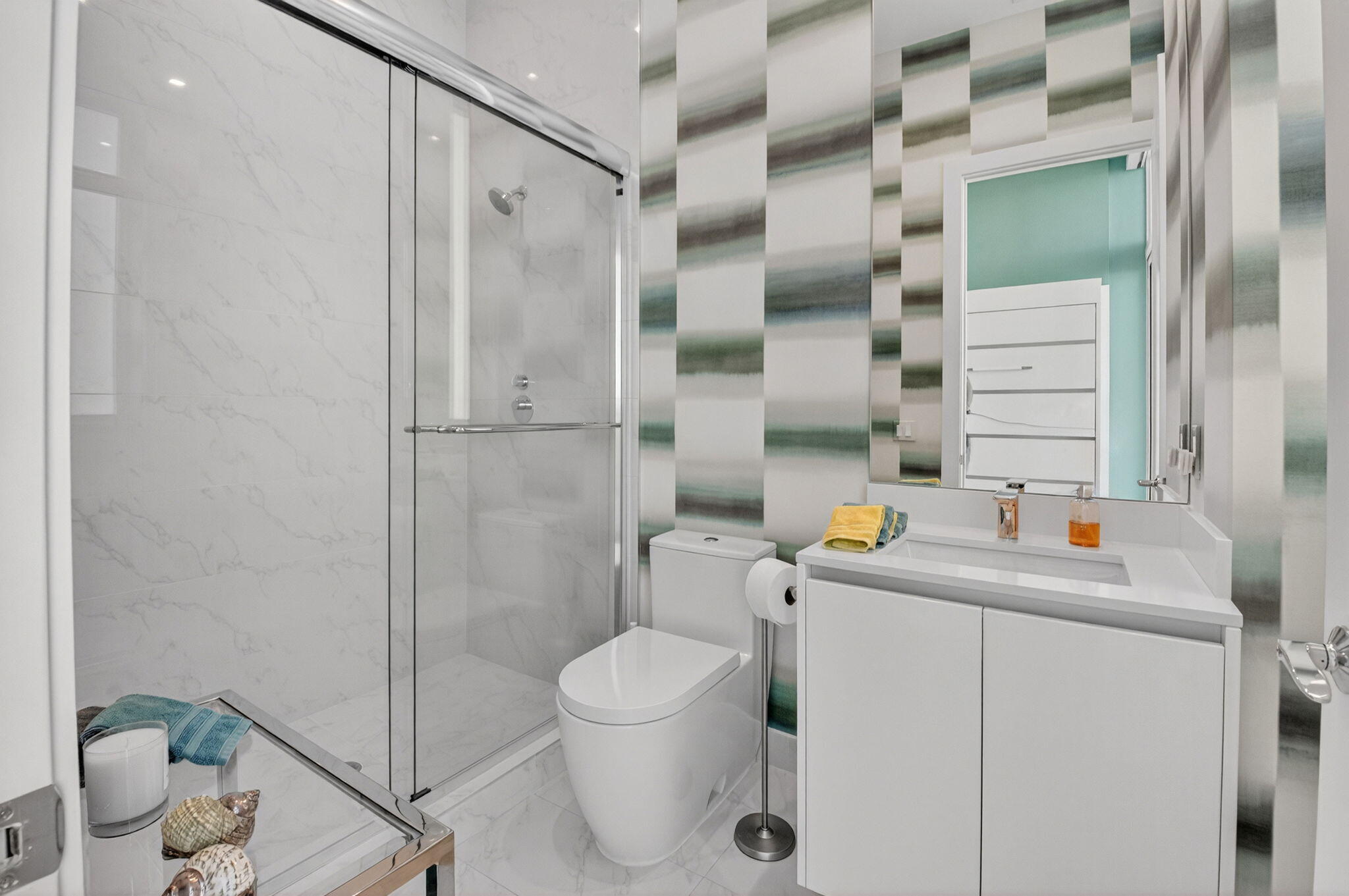 20155 Boca W Drive, Unit PHB904 Boca Raton, FL 33434 - Photo 26 of 50 a bathroom with a sink toilet and shower