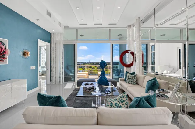 a living room with furniture and a large window