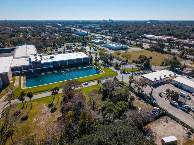 an aerial view of a house with a lake view