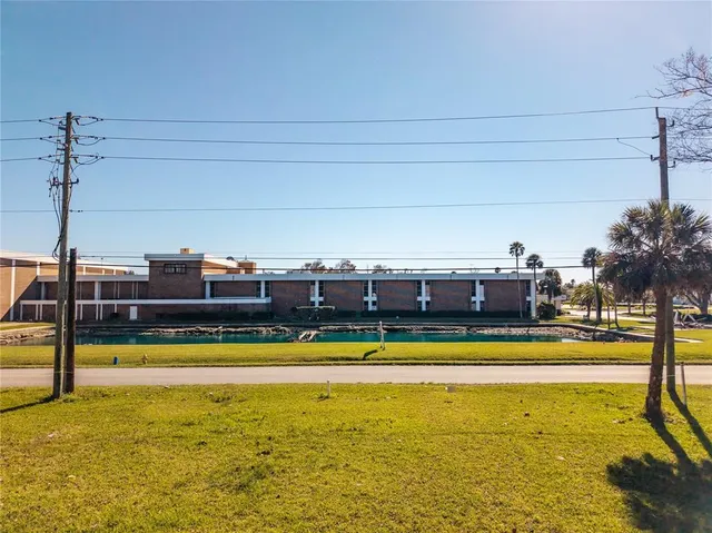 a view of swimming pool with outdoor seating and yard
