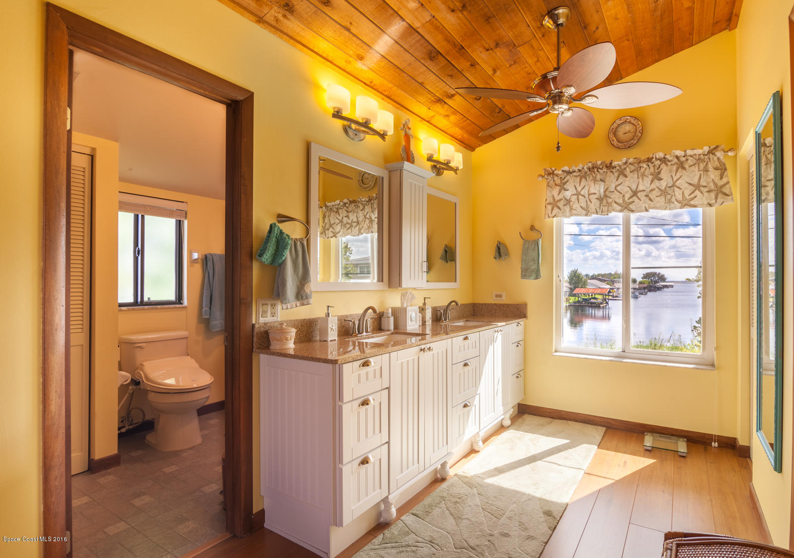 822 Cardinal Road Cocoa, FL 32926 - Photo 17 of 30 Master bathroom with view of canal/lake
