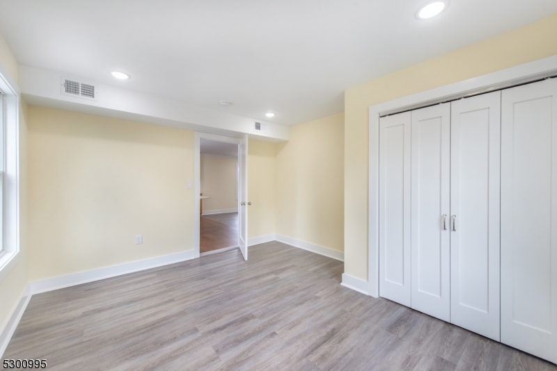 67 Harrison Street Nutley, NJ 07110 - Photo 17 of 20 a view of an empty room with wooden floor