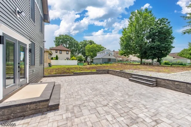 a view of backyard with trampoline