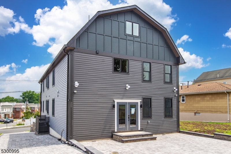 67 Harrison Street Nutley, NJ 07110 - Photo 20 of 20 a front view of a house with a garage