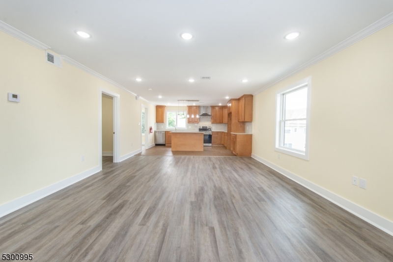 67 Harrison Street Nutley, NJ 07110 - Photo 6 of 20 a view of outdoor space with wooden floor and windows